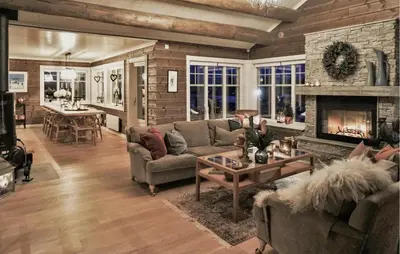a living room with a couch and a fireplace at Amazing Home In Gålå With Sauna in Gålå
