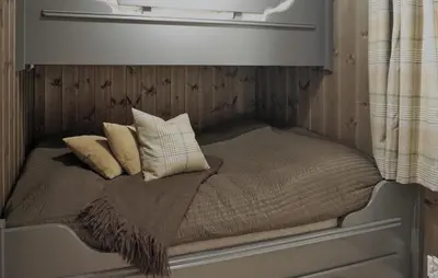 a small bed with pillows on it in a room at Amazing Home In Gålå With Sauna in Gålå