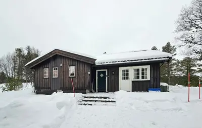 a small cabin in the snow with snow at Amazing Home In Rauland in Rauland