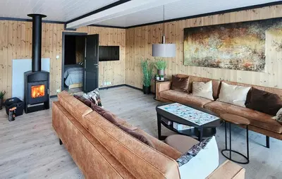 a living room with a couch and a fireplace at 3 Bedroom Awesome Apartment In Rjukan in Rjukan