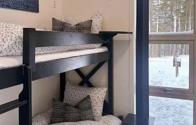 a bunk bed in a room with a window at Awesome Home In Oppdal With Sauna in Oppdal