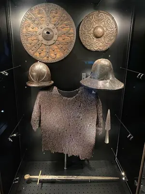 a display of hats and shields on a wall at FrysiaHouse in Lillehammer