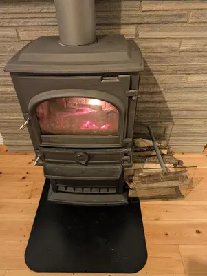 a stove sitting on top of a floor at Koselig kjellerleilighet, gratis parkering! in Trondheim