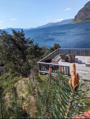 a deck with a view of a body of water at Hardangerfjord panorama 1 in Kvam