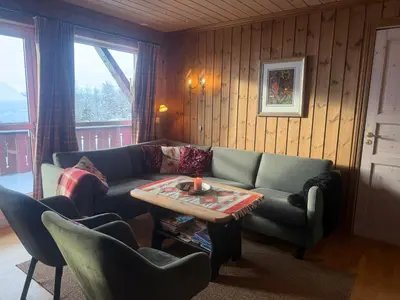 a living room with a couch and a table at Spacious Apartment For Up To 5 Guests in Beitostøl