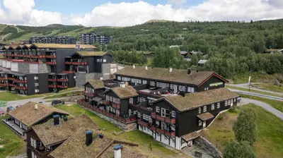 an aerial view of a building in a city at Spacious Apartment For Up To 5 Guests in Beitostøl