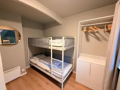 a walk in closet with bunk beds in a room at Historic Charm in Bergens Heart in Bergen