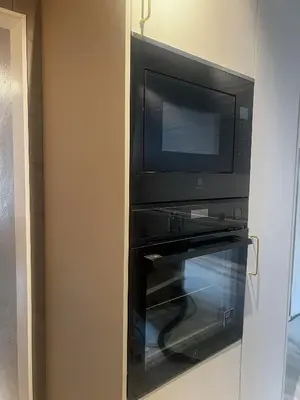 a microwave and a microwave oven in a room at Grandma`s house in Flåm