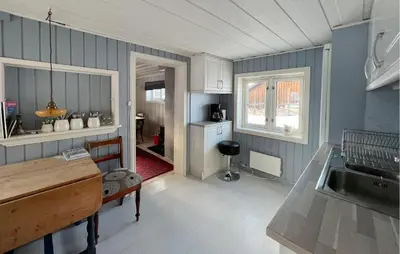 a kitchen with a sink and a counter top at Gorgeous Home In Svingvoll in Svingvoll