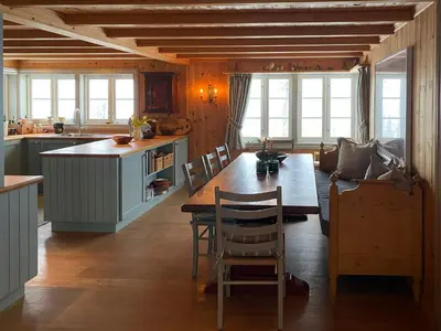 a kitchen with a large wooden table in a room at Traditional Cabin In Gålå With Stunning Nature in Gålå