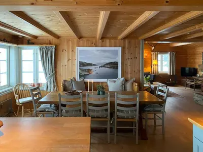 a dining room with a table and chairs at Traditional Cabin In Gålå With Stunning Nature in Gålå