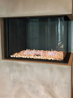 a glass window with a bunch of rocks in it at Ski-In Ski-Out Apartment In Trysil in Trysil