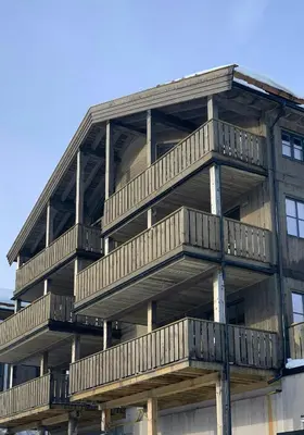 a building with balconies on the side of it at Ski-In Ski-Out Apartment In Trysil in Trysil