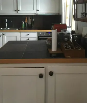 a kitchen with white cabinets and a counter top at Mountain Cabin With Views And Close To Ski Trails in Aurdal