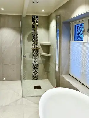 a shower with a glass door in a bathroom at Charming & Modern Seaside House In Valsøyfjord in Valsøyfjord