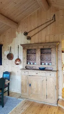 a room with a wooden wall with a counter in it at Charming Cabin With Views In Valdres in Aurdal