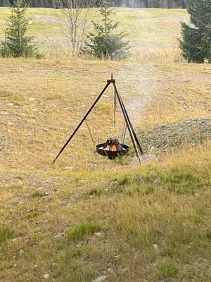 a swing in the middle of a field at Lovely, New Apartment At Kvitfjell With Ski-In Out in Fåvang