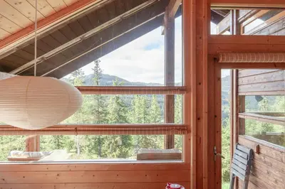 a room with a large window with a large light fixture at Architectural Gem Near Cross Country Trails in Eggedal