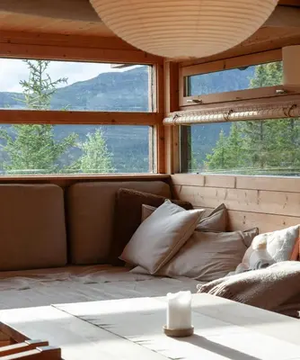 a room with a couch and two large windows at Architectural Gem Near Cross Country Trails in Eggedal