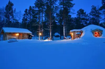 a couple of igloo houses in the snow at night at Unique Hobbit Cabin By Hallingskarvet in Hovet