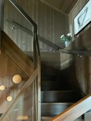 a staircase in a tiny house at Spacious Mountain Cabin With Fantastic Views in Ål
