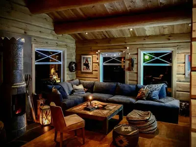 a living room with a couch and a table at Rustic Log Cabin At The Foot Of Hardangervidda in Uvdal