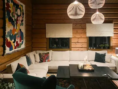 a living room with a couch and a table at Timber Cabin With Fantastic View In Oppdal in Oppdal