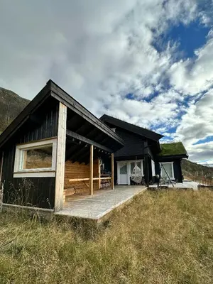 a black house with a grass roof at Mountain Cabin Near Solheisen In Grøndalen in Hemsedal