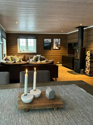 a living room with two candles on a table at Family Cabin With Ski Inout At Furutangen in Vika