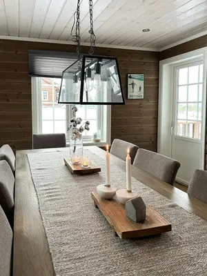 a dining room with a table with candles on it at Family Cabin With Ski Inout At Furutangen in Vika