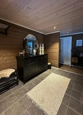 a room with a dresser and a mirror and a rug at Family Cabin With Ski Inout At Furutangen in Vika