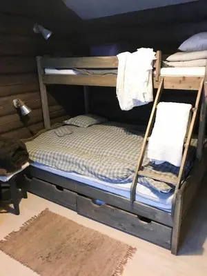 a bedroom with two bunk beds with towels on them at Mountain Cabin With A View Over Jotunheimen in Tretten