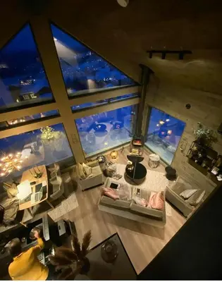 an overhead view of a living room at night at Cabin With Panoramic And Ski Trails Outside in Rauland