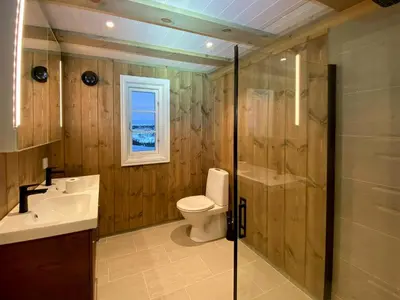 a bathroom with a toilet and a sink and a shower at Cabin With Panoramic View In Synnfjell in Nord Torpa