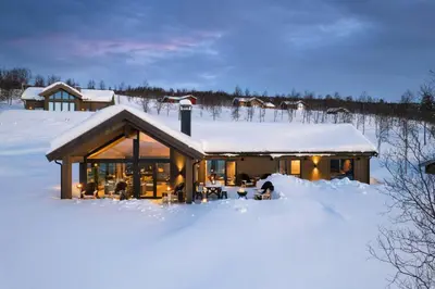 a house in the snow with snow covered ground at Unique & Exclusive Mountain Cabin In Geilo in Geilo