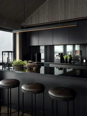 a kitchen with three bar stools at a counter at Unique & Exclusive Mountain Cabin In Geilo in Geilo