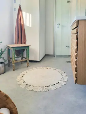 a room with a rug on the floor and a table at Sunny Cabin With Panoramic Views At Sjusjøen in Sjusjøen