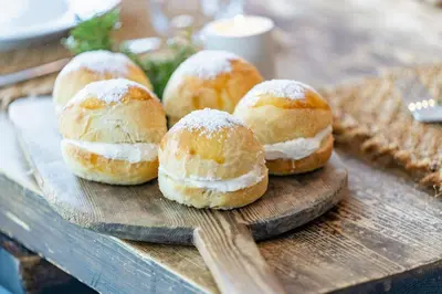 a group of buns on a wooden cutting board at Charming House In Loen, In The Heart Of Nordfjord in Loen