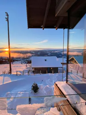 a winter view of a building in the snow at Ski Inski Out-Hytte I Hafjell Med Udsigt in Øyer