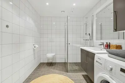 a bathroom with a toilet and a shower and a sink at Cosy Apartment With Ski Inout In Hafjell in Øyer