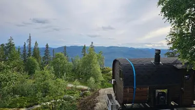 a log cabin with a roof on top of it at Mountain Cabin With Stunning Views, Sauna & Lake in Eggedal