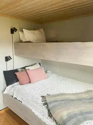 a bed in a room with two bunk beds at Family Cabin With Views In Sør-Fron in Sør-Fron
