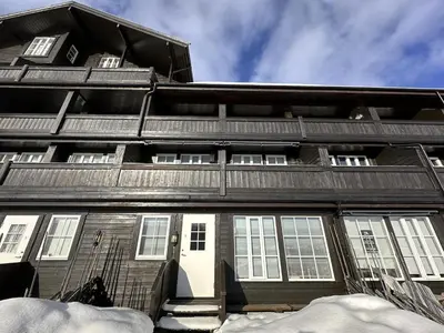an apartment building with snow in front of it at Cozy Two Bedrooms Apartment With Sauna And Mountain Views in Beitostøl