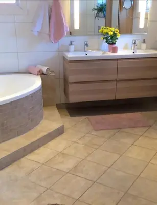 a bathroom with two sinks and a bath tub at Lodge Orkanger - Spacious Comfort - Designed for family moments in Orkanger