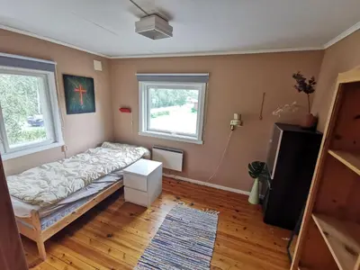 a bedroom with a bed and two windows at Hemsedal - 5 bedrooms in Fausko