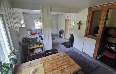 a living room with a table and a couch at Hemsedal - 5 bedrooms in Fausko