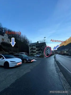 a street with cars parked on the side of the road at StarApartment Trolltunga 2 BR in Odda