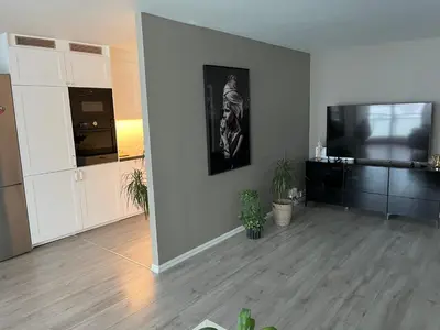 an empty living room with a flat screen tv at Ski VM in Trondheim