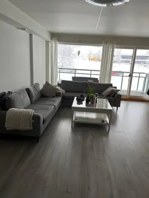 a living room with a couch and a coffee table at Ski VM in Trondheim