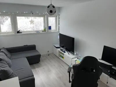 a living room with a couch and a tv at Trondheim in Trondheim